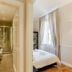 Relais Tosinghi Florence hotel room and en-suite bathroom with walk-in shower, sink, and large window