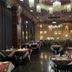 Asdal Boutique Hotel Seef in Manama restaurant with set tables, buffet line, and ornate ceiling lighting