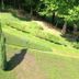 Hotel Martina in Bad Sooden-Allendorf with a landscaped green hillside and tall cypress trees