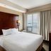 Residence Inn by Marriott Kingston Water's Edge guest room with king bed and waterfront window view in Kingston