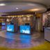 Hotel Indigo Asheville Downtown by IHG lobby with blue-lit reception desks and modern circular ceiling in Asheville