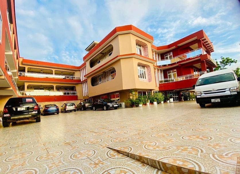 Golden Key Hotel in Accra exterior courtyard with parked cars and multi-story balconies