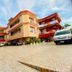 Golden Key Hotel in Accra exterior courtyard with parked cars and multi-story balconies