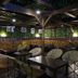 Kumano No Yado Umihikari in Kumano: covered outdoor lounge with tables, chairs and string lights