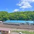 Hotel Sun Abashiri in Abashiri with hillside forest and railway view under a blue sky