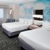 Courtyard by Marriott Tuscaloosa guest room with two queen beds, desk, and chair