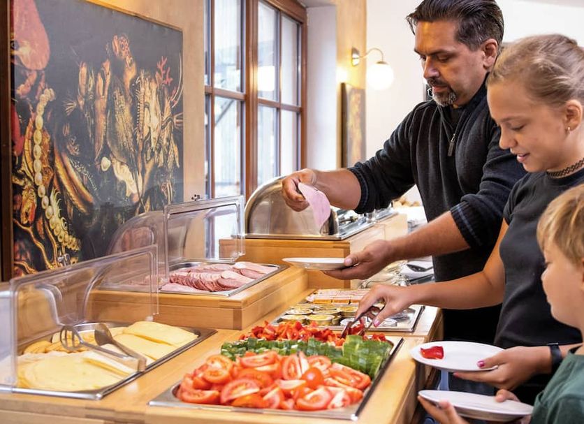 Hotel U Kata in Kutná Hora breakfast buffet with guests serving themselves at a food counter