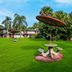 Red Roof Inn Vero Beach - I-95 in Vero Beach with a grassy courtyard and shaded picnic table