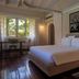 Ocean Beach Resort & Spa Malindi guest room with king bed, window seating area and tropical view