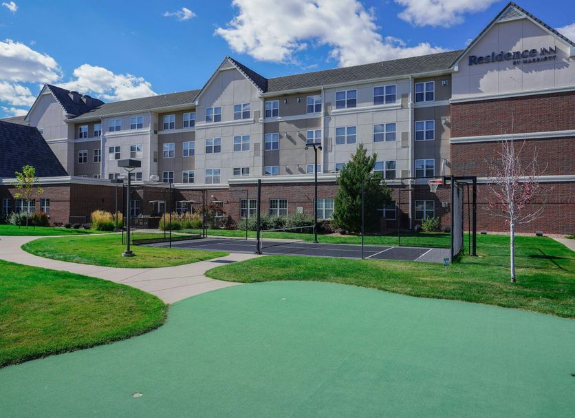Residence Inn by Marriott Colorado Springs North/Air Force Academy exterior with landscaped lawn and putting green