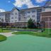 Residence Inn by Marriott Colorado Springs North/Air Force Academy exterior with landscaped lawn and putting green