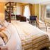 Holbeck Ghyll Country House Estate in Windermere, a bedroom with balcony view and spiral staircase