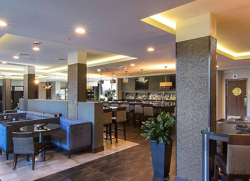Staybridge Suites Carlsbad - San Diego By IHG lobby lounge with bar seating and modern tables