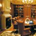Beau Rivage Resort and Casino in Biloxi conference room with oval table, leather chairs, shelves and chandelier