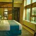 AG Hotel Abu Dhabi guest room with king bed, large windows and city view