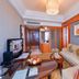 New Century Hotel Pudong Shanghai room with sofa, TV, coffee table and city view in Shanghai