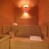 Montebelli Agriturismo & Country Hotel in Grosseto sauna with wood benches and striped lamp