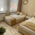Altstadt-Hotel Gosequell in Goslar guest room with two single beds and a window