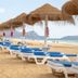 Vila Baleira Porto Santo beach with loungers, straw parasols and ocean view in Porto Santo