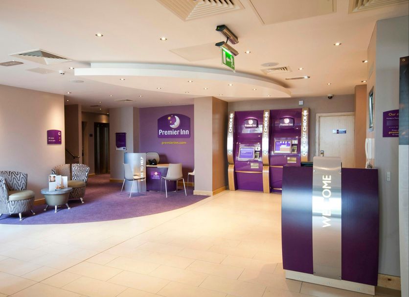 Premier Inn Edinburgh Airport lobby with seating and reception desks in Edinburgh