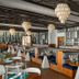 TRS Turquesa by Palladium in Punta Cana: stylish adults-only restaurant with booth seating and chandeliers
