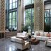 Tian Xing Hotel Chongqing lobby with tall windows, marble floor, and seating area