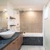 Pullman Palm Cove Sea Temple Resort and Spa bathroom with soaking tub, vanity and walk-in shower