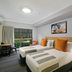Potters Toowoomba Hotel room with two beds and a balcony view in Toowoomba