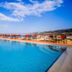 Kythea Resort in Agia Pelagia with a large outdoor pool overlooking the sea and lounge chairs