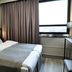 Original Sokos Hotel Rikala room in Salo with a double bed, large window, and curtains