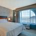 Home2 Suites by Hilton Orlando at FLAMINGO CROSSINGS Town Center guest room with king bed and window view