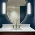 Hotel Indigo Nashville - The Countrypolitan By IHG bathroom vanity with oval mirror and wall sconces