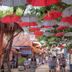 Gili Amor Boutique Resort in Pemenang, shaded resort walkway with red and gray umbrellas
