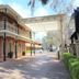 Carlyle Suites and Apartments in Wagga Wagga with red-brick facade, balconies and covered driveway entrance