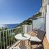 Maresca Hotel Praiano balcony with sea view, table and chairs overlooking the coast in Praiano