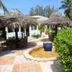 Stella Maris Resort Club in Stella Maris with thatched palapas, outdoor seating, and tropical landscaping