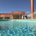 Best Budget Inn - Abilene outdoor pool with fenced deck and clear blue water in Abilene