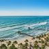 Jungala Hotel at VidantaWorld Riviera Maya, Cancún, with beachfront ocean waves and palm-lined shore