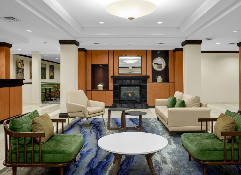 Fairfield Inn & Suites by Marriott Paducah lobby seating area with fireplace and blue patterned carpet