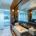Vivanta Bengaluru, Whitefield bathroom with vanity, large mirror and glass shower enclosure in Bengaluru