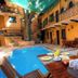 Dona Elvira Boutique Hotel in Santo Domingo with courtyard pool and outdoor dining by the water