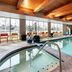 Home2 Suites by Hilton Anchorage/Midtown indoor pool with large windows and mountain views in Anchorage