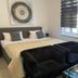 Altstadt-Hotel Gosequell guest room in Goslar with bed, black armchairs and glass coffee table