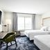 Fairfield Inn & Suites by Marriott Sheboygan room with two beds, desk, and window view