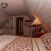 Gîte Au Coin De La Berge bedroom with sloped ceiling, sink, and lamp in Percé
