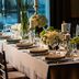 Renaissance Boulder Flatiron Hotel in Broomfield: elegant candlelit banquet table set with flowers and glassware