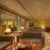 Siji Hotel Apartments in Fujairah lounge with gray sofas, table lamps and checkered flooring