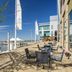 The Westin Washington National Harbor waterfront patio with outdoor seating and ferris wheel view