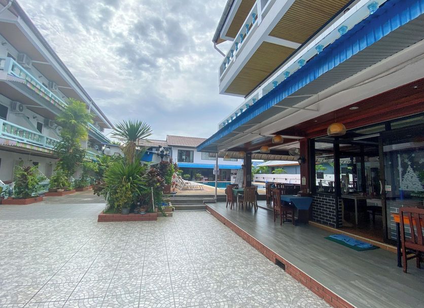 Rabbit Mansion Patong Hotel courtyard with outdoor seating and poolside view in Patong