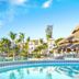Be Live Experience Hamaca Suites in Boca Chica with a lagoon-style pool and thatched palapa bar
